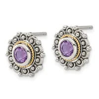 Pair of silver and gold stud earrings featuring oval purple amethyst stones surrounded by ornate beaded frames.
