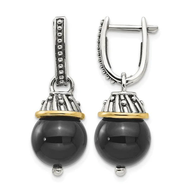 Pair of silver and gold-tone drop earrings with polished black onyx spheres suspended from decorative caps and rectangular hinged posts.