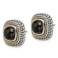 Pair of two-tone silver and gold rectangular earrings with black onyx cabochon centers surrounded by textured metalwork and rope-like trim.