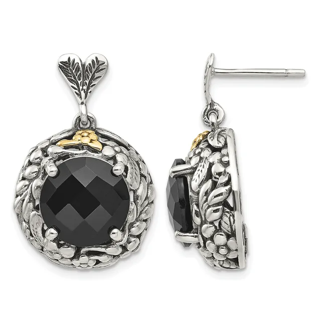 Pair of silver and gold drop earrings featuring black faceted onyx stones surrounded by ornate leaf and beaded metalwork, shown from front and side views.