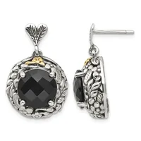 Pair of silver and gold drop earrings featuring black faceted onyx stones surrounded by ornate leaf and beaded metalwork, shown from front and side views.