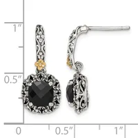 A pair of ornate silver and gold drop earrings with black faceted square stones surrounded by decorative metalwork, shown next to a measurement scale.