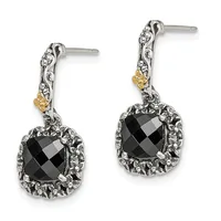 A pair of silver drop earrings with ornate filigree posts featuring gold accents, each suspending a faceted black onyx stone surrounded by textured metalwork.