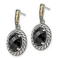 Pair of silver and gold two-tone drop earrings with faceted black oval stones surrounded by twisted rope detailing and small hallmarks.