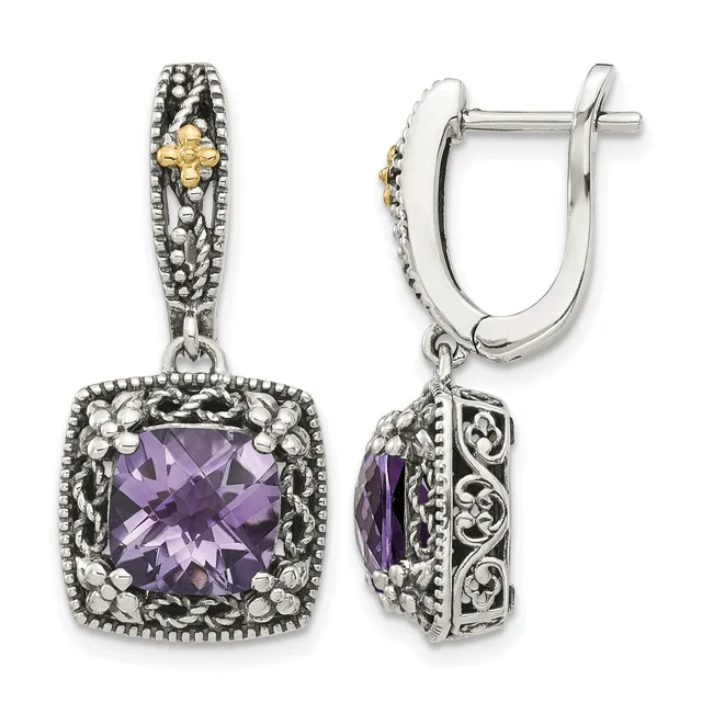 Pair of silver drop earrings with ornate filigree designs, featuring cushion-cut amethyst stones surrounded by decorative scrollwork and beaded borders.