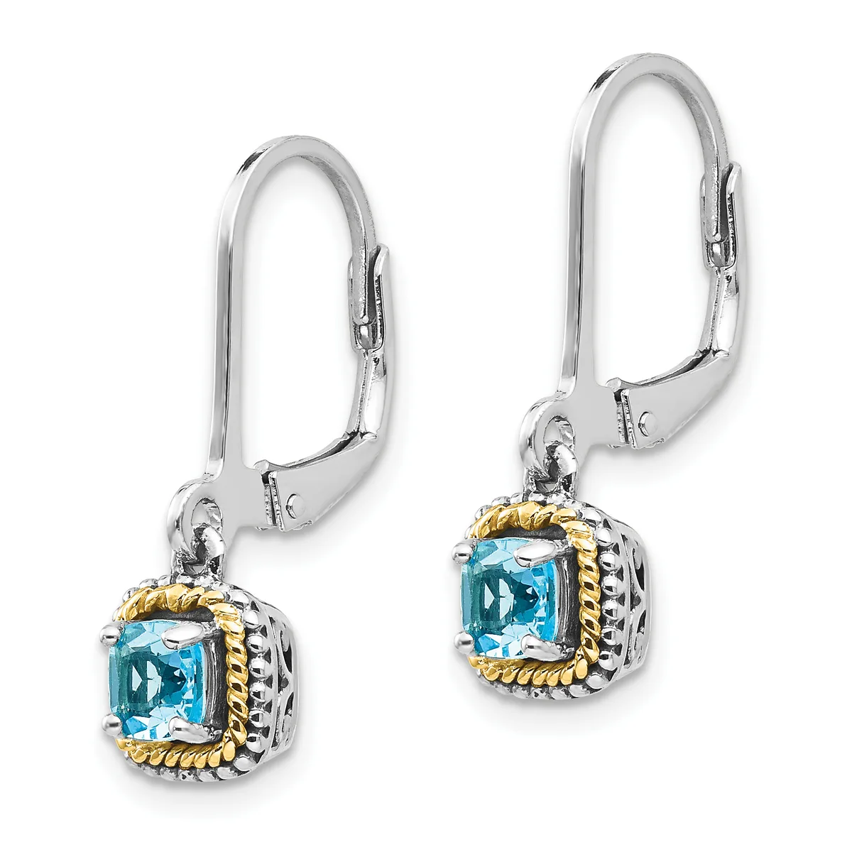 A pair of silver lever-back earrings with square blue topaz stones surrounded by twisted gold-tone bezels and textured silver settings.