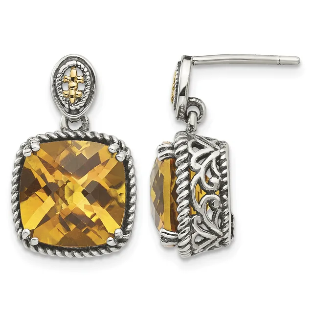 Pair of silver and gold two-tone dangle earrings with cushion-cut citrine stones surrounded by ornate filigree and rope-textured bezels, shown from front and side views.