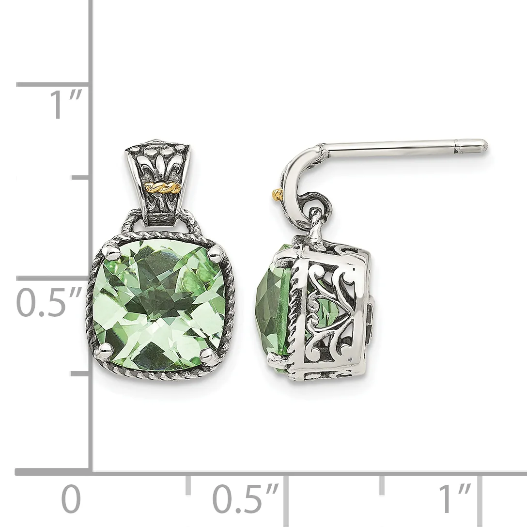 Pair of silver drop earrings with cushion-cut green gemstones, ornate filigree settings, and post backs, displayed against a measurement scale.