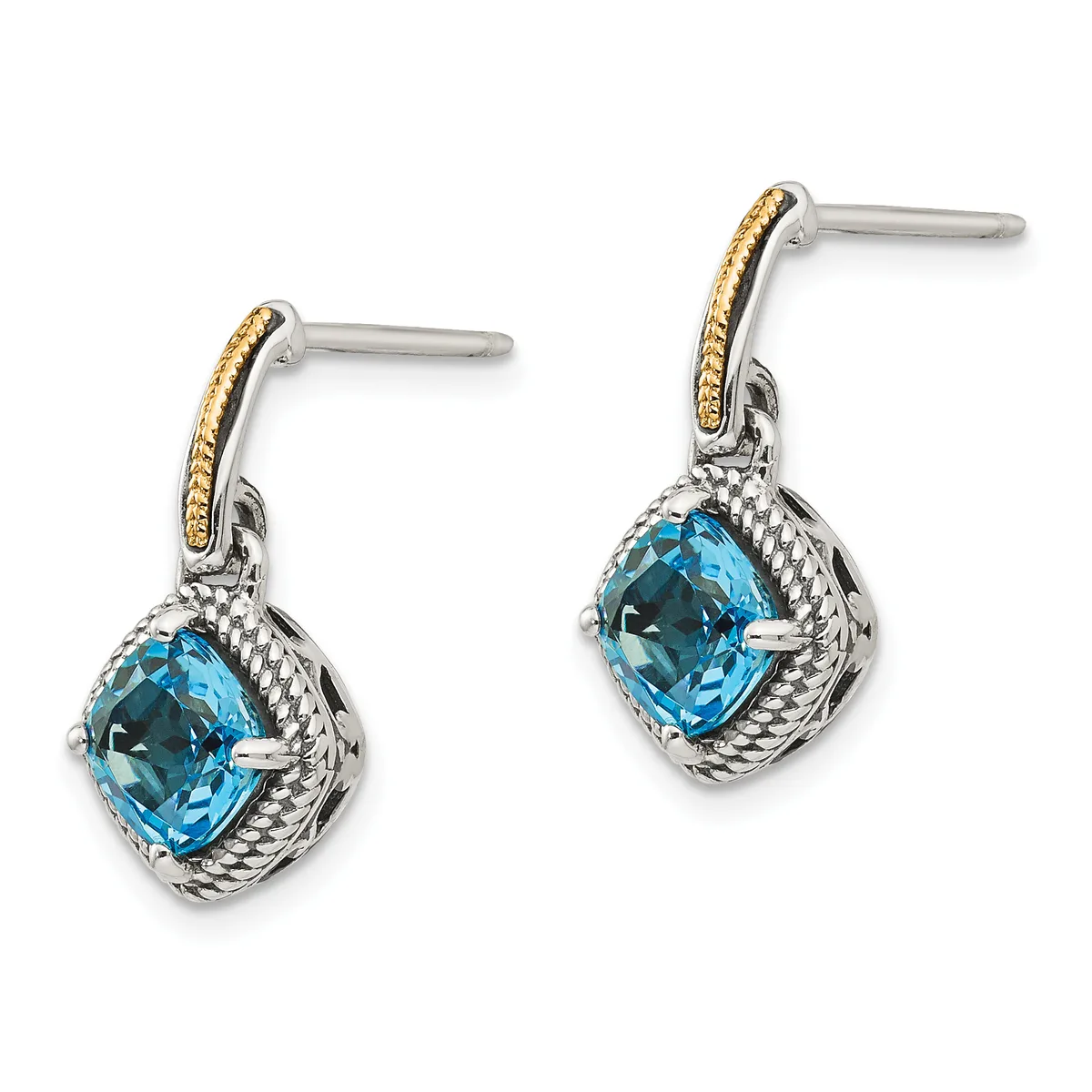 A pair of silver drop earrings with cushion-cut blue topaz stones surrounded by twisted rope detailing and gold-accented posts.