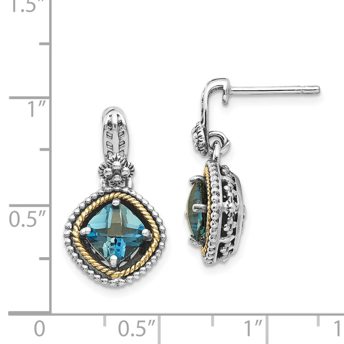 Pair of two-tone drop earrings with cushion-cut blue topaz centers surrounded by twisted gold and silver bands with diamond accents, shown next to a measurement scale.