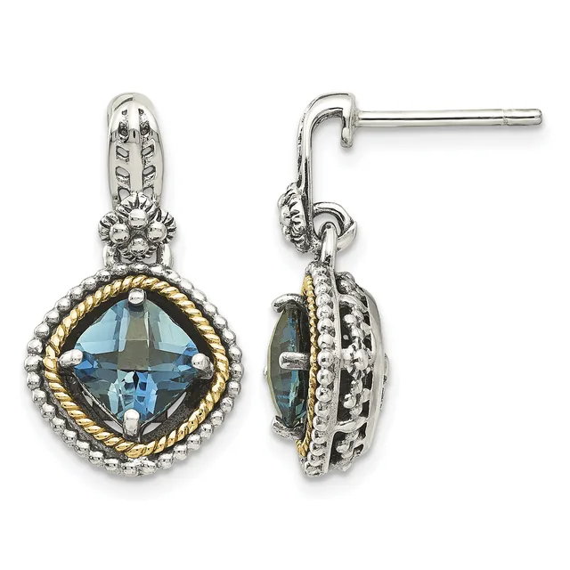 Pair of silver and gold-tone drop earrings with cushion-cut blue topaz stones surrounded by beaded and twisted rope borders, shown from front and side views.