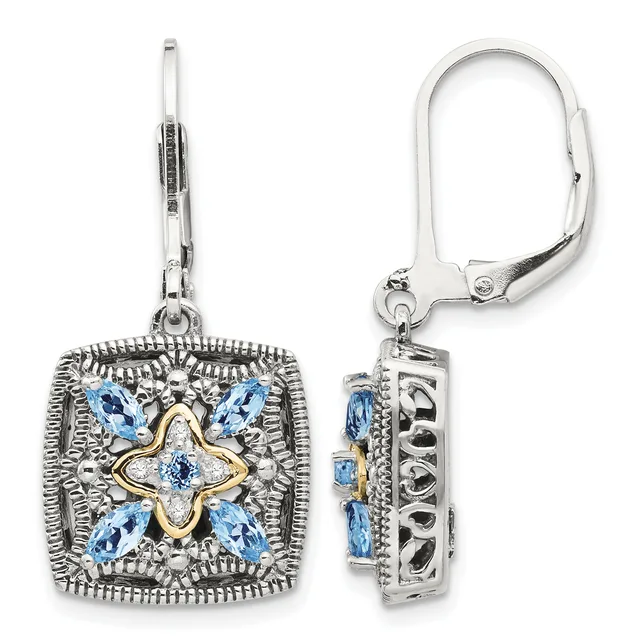 Pair of silver and gold filigree square earrings with blue gemstones arranged in a four-pointed star pattern, shown from front and back views with lever-back closures.