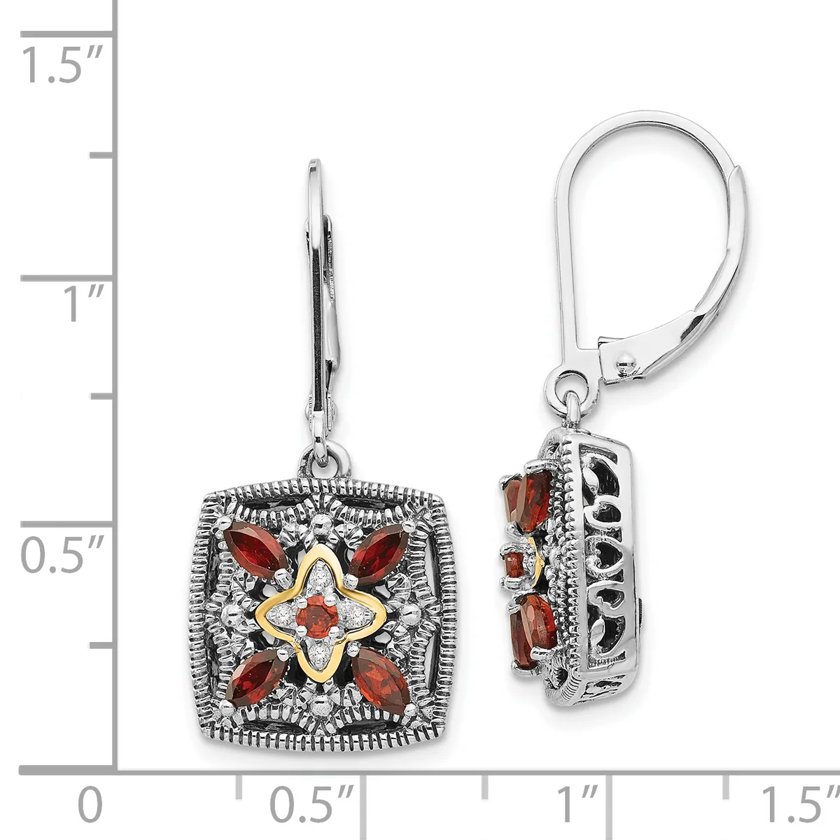 Pair of ornate square drop earrings with red gemstones arranged in a floral pattern, accented with gold-tone and silver-tone metalwork, displayed on a measurement scale.