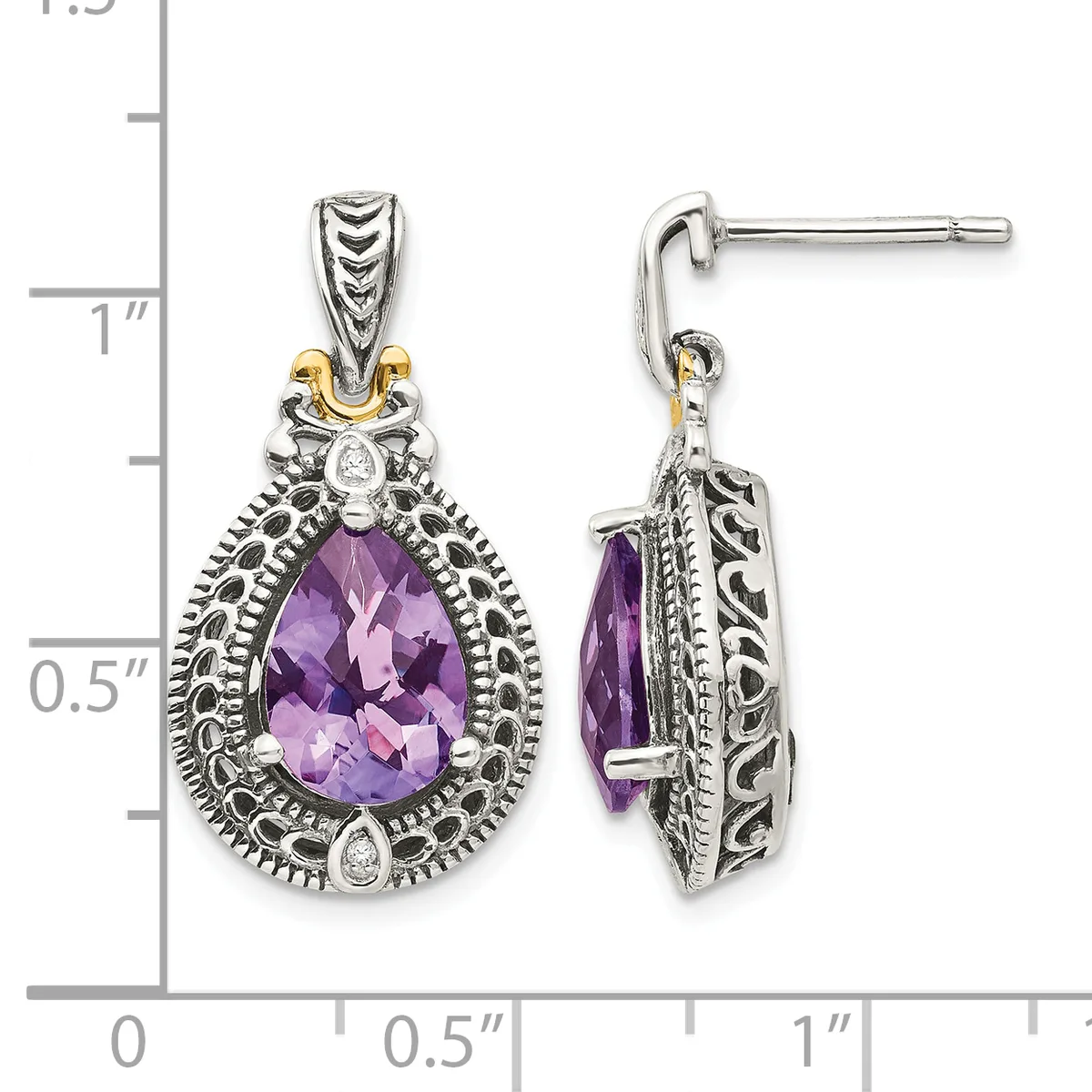 Two teardrop-shaped silver earrings with ornate scrollwork frames featuring purple faceted amethyst stones, shown front and side view against a measurement scale.