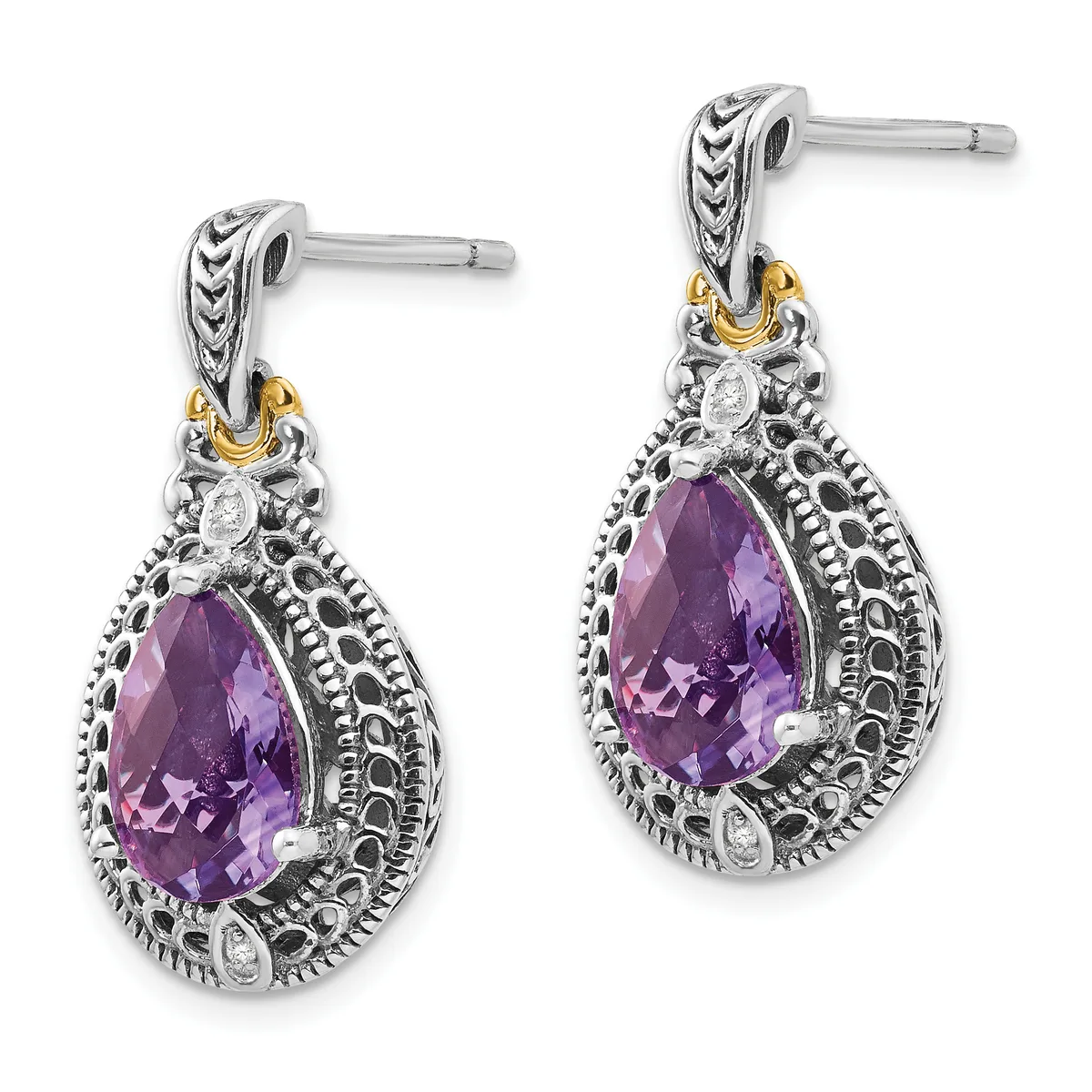 Pair of silver drop earrings with teardrop-shaped purple gemstones surrounded by ornate filigree detailing and gold-tone accents on the posts.