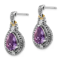 Pair of silver drop earrings with teardrop-shaped purple gemstones surrounded by ornate filigree detailing and gold-tone accents on the posts.