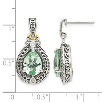 A pair of ornate silver teardrop earrings with green faceted gemstones, decorative filigree frames, and gold accents, shown front and back views with a measurement scale.