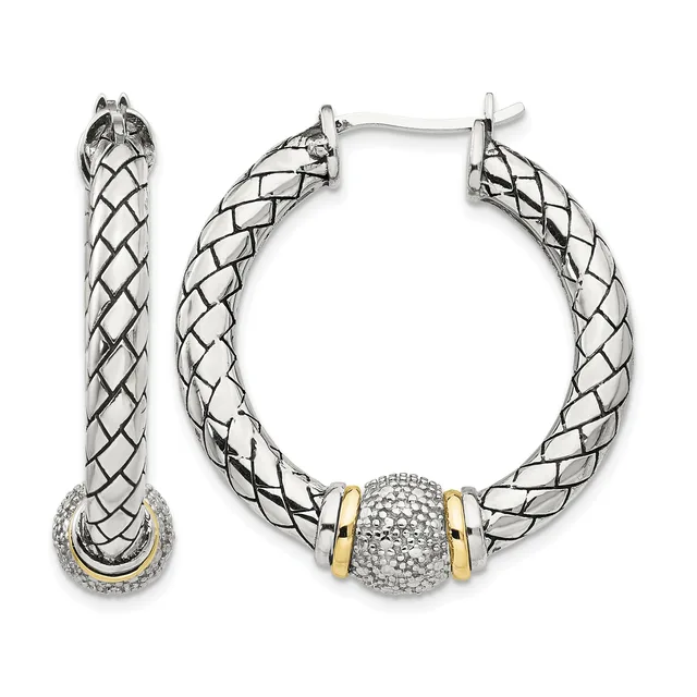 Pair of silver hoop earrings with twisted rope texture, gold-tone accents, and a pave crystal ball charm on one earring, shown front and side view.