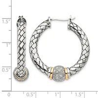 Silver and gold twisted hoop earrings with a diamond-encrusted barrel bead accent, shown on a measurement scale indicating approximately 1.5 inches in length.
