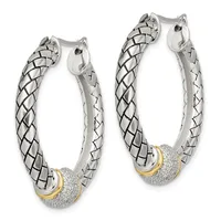 Pair of silver hoop earrings with quilted texture, gold-tone accents, and diamond-paved spheres, shown front and back views.