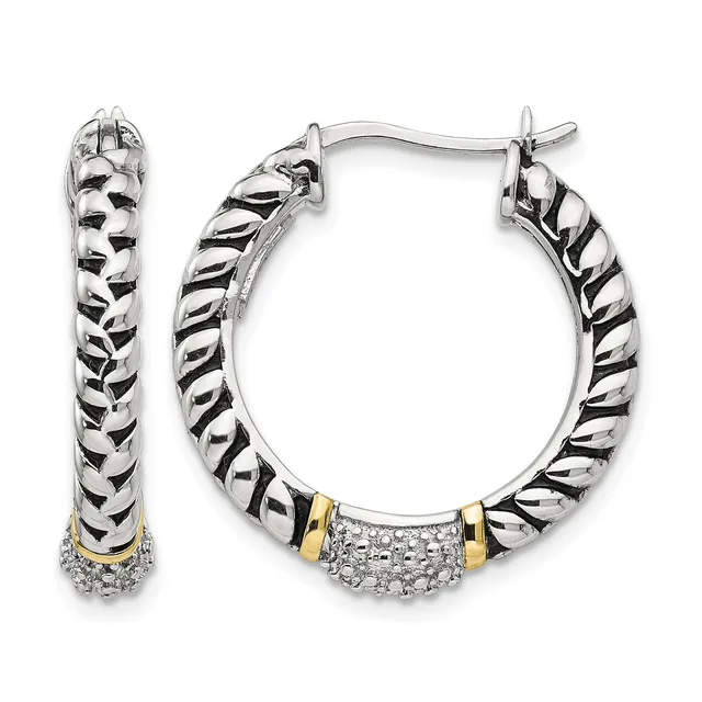 Pair of two-tone silver and gold hoop earrings with twisted rope texture and diamond-accented bands at the bottom, shown from front and side views.