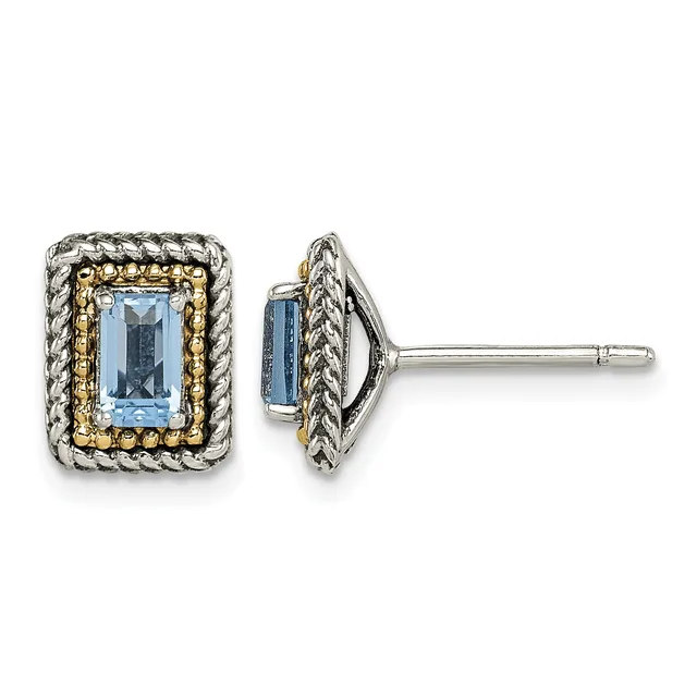 Pair of rectangular stud earrings with light blue faceted stones set in two-tone metal with twisted rope and beaded borders, shown from front and side views.