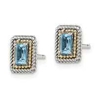 A pair of rectangular stud earrings with light blue gemstones set in silver with gold-toned beaded borders and twisted silver rope frames.