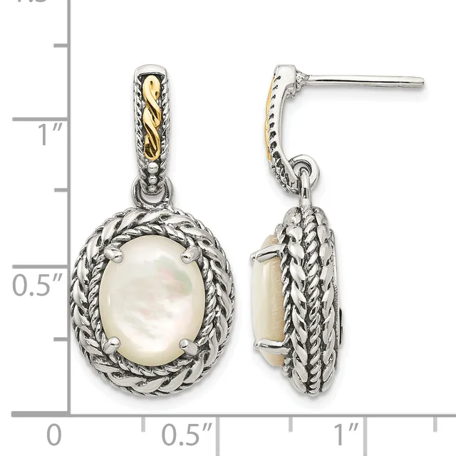 Pair of silver and gold two-tone dangle earrings with oval white mother-of-pearl centers surrounded by twisted rope detailing, shown front and back views with a measurement scale.