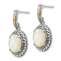Pair of silver and gold-tone dangle earrings with oval white mother-of-pearl stones surrounded by decorative twisted metalwork frames.