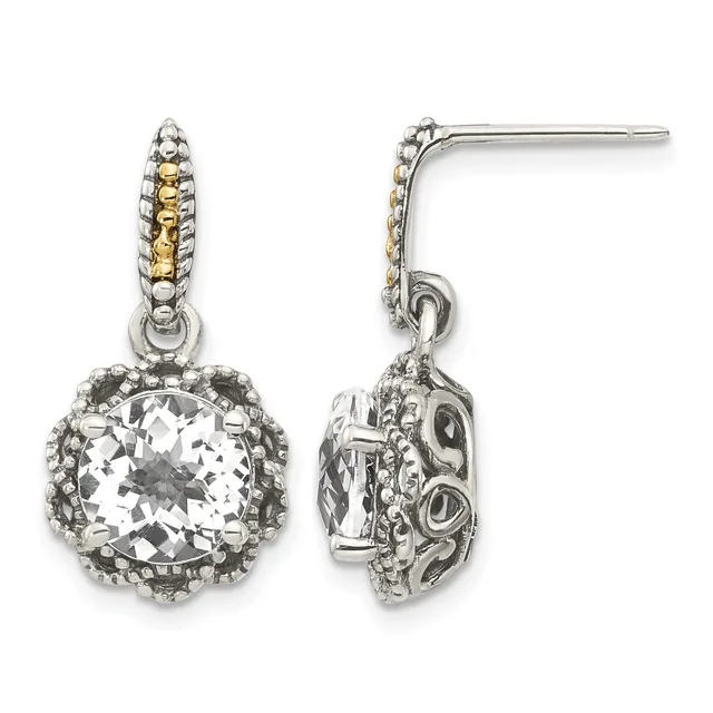 Pair of silver drop earrings with ornate filigree posts, each featuring a large cushion-cut clear crystal stone surrounded by a decorative beaded border, shown from front and side views.