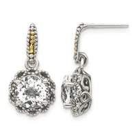 Pair of silver drop earrings with ornate filigree posts, each featuring a large cushion-cut clear crystal stone surrounded by a decorative beaded border, shown from front and side views.