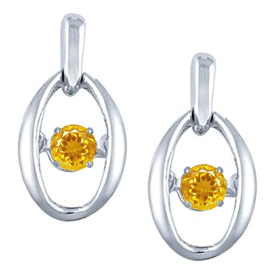 Pair of silver oval drop earrings with yellow round gemstones suspended in the center of each loop.