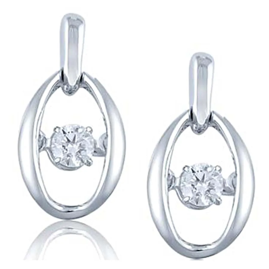 Pair of silver oval pendant earrings with suspended diamond solitaires at the center, shown with matching posts and backs.