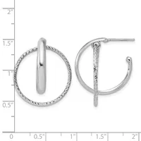 A pair of silver hoop earrings with a twisted textured outer band and polished inner band, shown against a measurement scale.