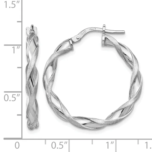 A pair of silver twisted hoop earrings with post and clutch backs, shown against a ruler measuring approximately 1.5 inches in length.