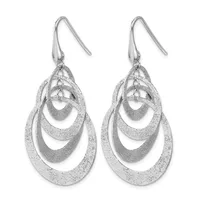 Pair of silver teardrop earrings with nested oval rings featuring a textured finish, suspended from hook-style wires.