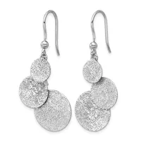 A pair of silver dangle earrings with textured circular discs in graduated sizes, suspended from hook-style ear wires with small beads.