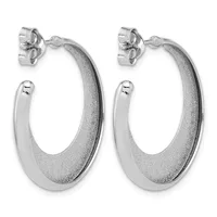 A pair of silver hoop earrings with a textured finish and polished smooth sections, displayed side by side with stud post backs visible.
