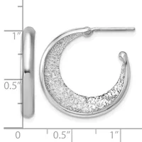 Silver hoop earrings with a textured sparkly finish on the outer surface and polished smooth inner surface, shown with a measurement scale indicating approximately one inch in length.