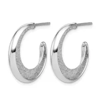 Pair of silver hoop earrings with polished upper halves and textured lower halves, shown from the front.