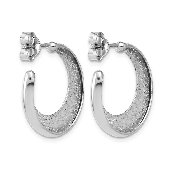 A pair of silver hoop earrings with textured surfaces on the outer edges and polished smooth inner curves, shown from the front against a white background.