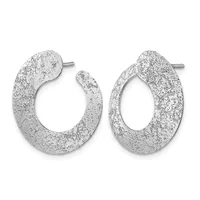 A pair of silver hoop earrings with a textured, speckled finish and posts for pierced ears, shown from the front.