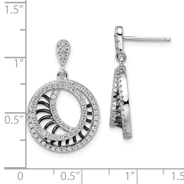 A pair of silver dangle earrings with circular open designs outlined in cubic zirconia and black enamel striping, shown against a measurement scale.