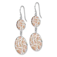 A pair of silver fishhook earrings with oval pendants featuring peach-colored stone inlaid with white geometric patterns, suspended from decorative silver connectors.
