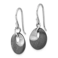 A pair of silver drop earrings with textured oval pendants featuring cutout details, suspended from curved ear wires.