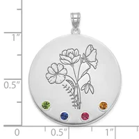 Silver circular pendant with engraved floral design and four round colored gemstones positioned at cardinal points, shown next to a ruler for scale.
