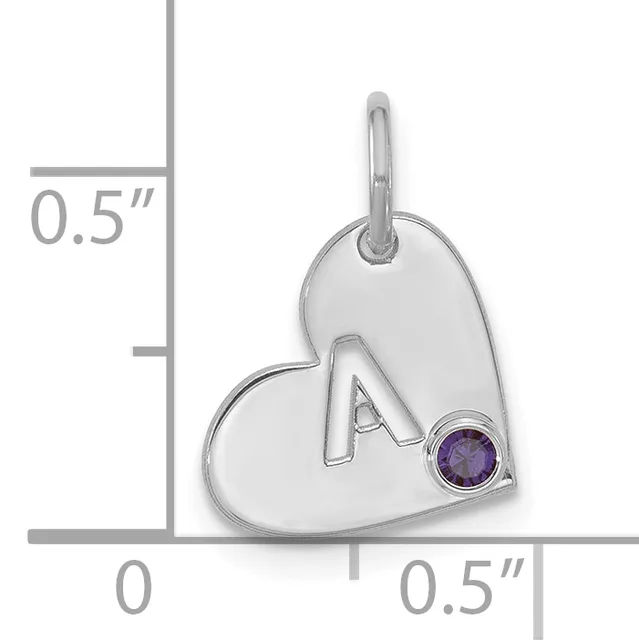 Silver heart-shaped pendant with the letter A and a small purple gemstone, shown next to a measurement scale indicating approximately 0.5 inches in height and width.