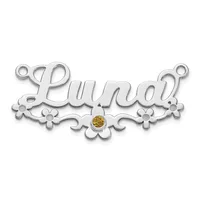 Silver pendant with the name Lundi in cursive script, decorated with floral flourishes on either side and a small amber-colored stone in the center.