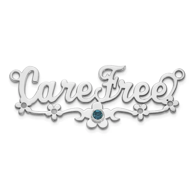 Silver ornament pendant with decorative flourishes and a blue gemstone in the center, spelling out text in an ornate script font.