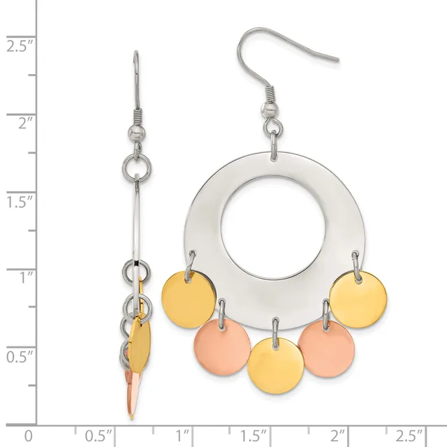 A pair of silver-tone earrings with white enamel rings suspended from fish hooks, decorated with dangling yellow and peach enamel circles, shown next to a measurement scale.